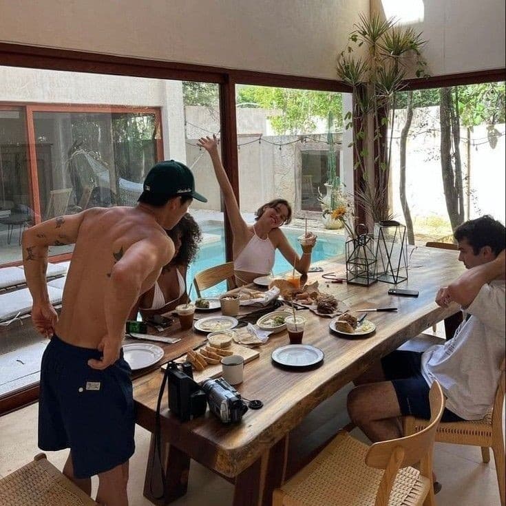 Friends connecting over breakfast by the pool